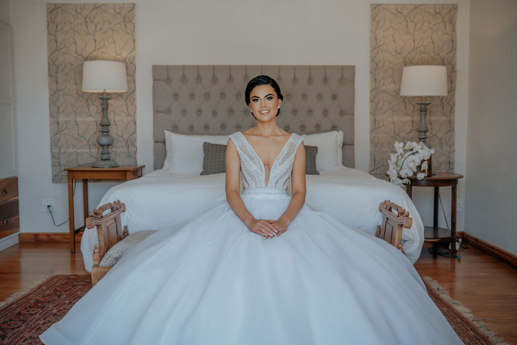 Bride seated in a beautifully decorated room