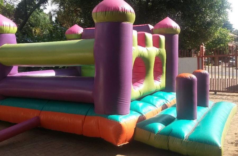 Colorful inflatable jumping castle setup in a garden