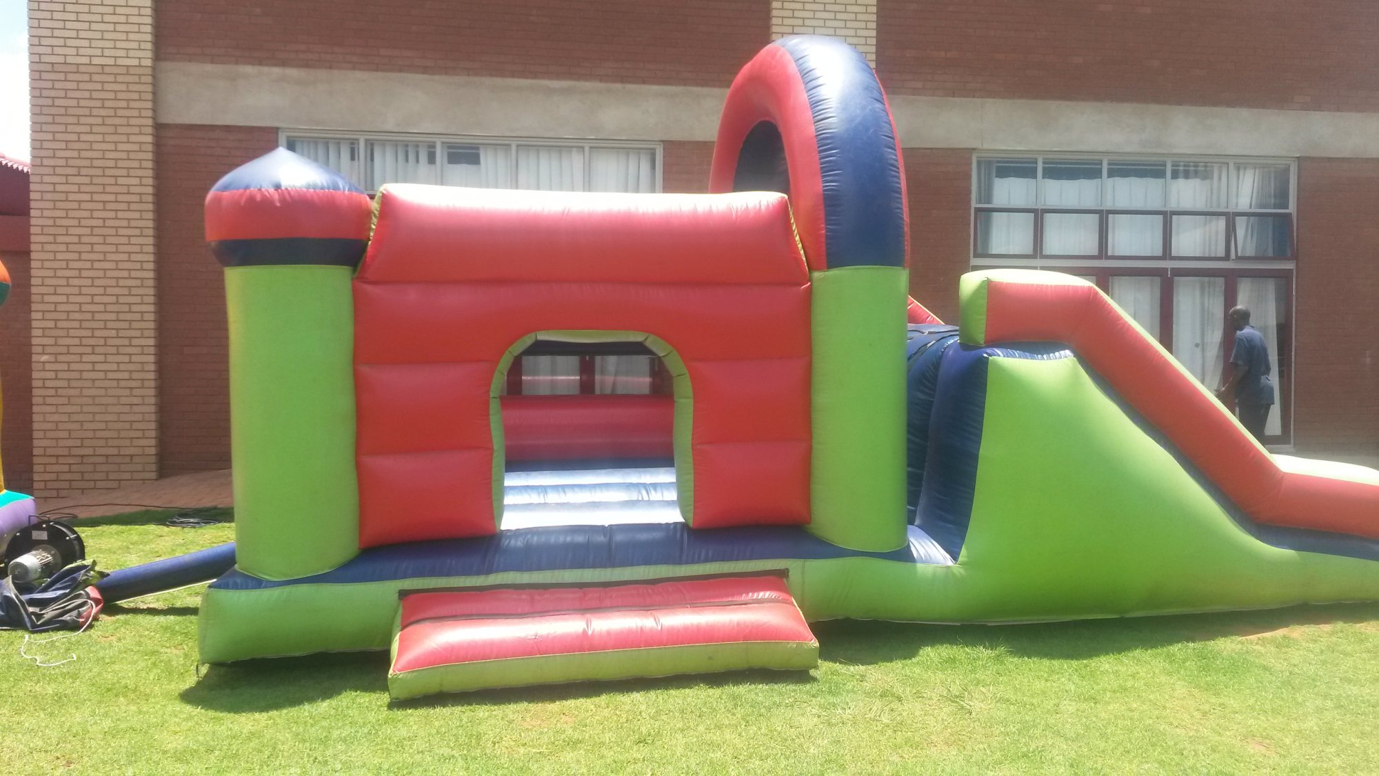 A colorful junior jumping castle set up outdoors