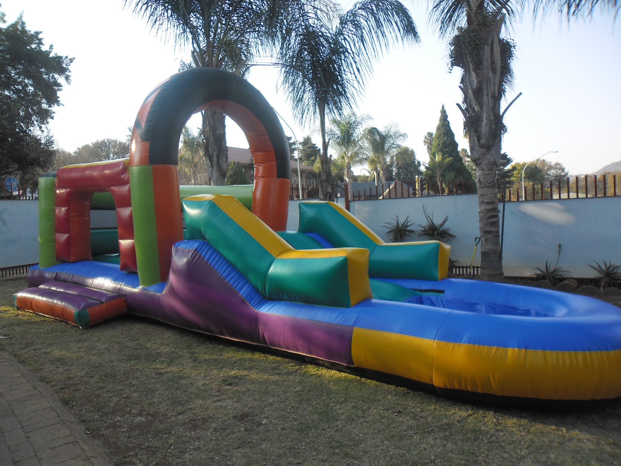 Inflatable water castle with slides in bright colors