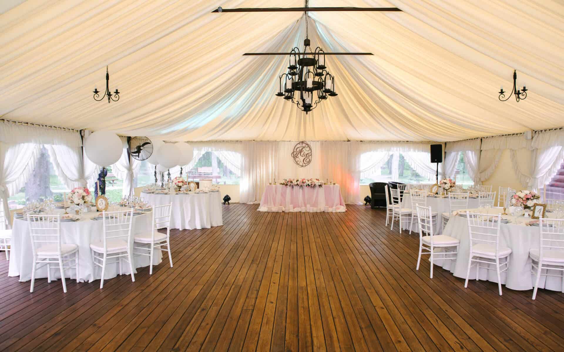 Interior view of a stretch tent with tables and chairs