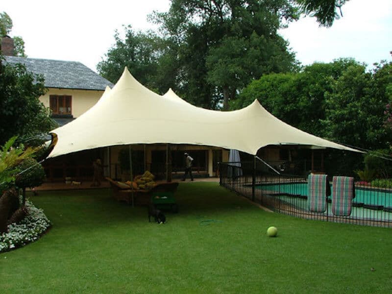 Bedouin-style stretch tent set up in a garden