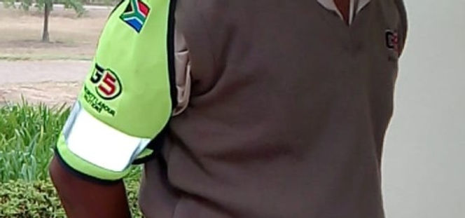 Close-up of a G5 Security guard's uniform sleeve with logo.