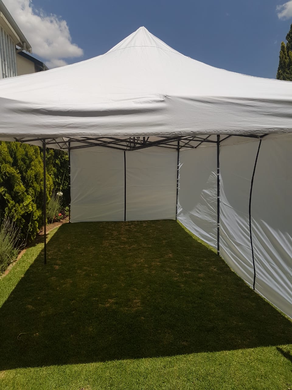 3 x 6 metre gazebo with sidewalls in an outdoor setting