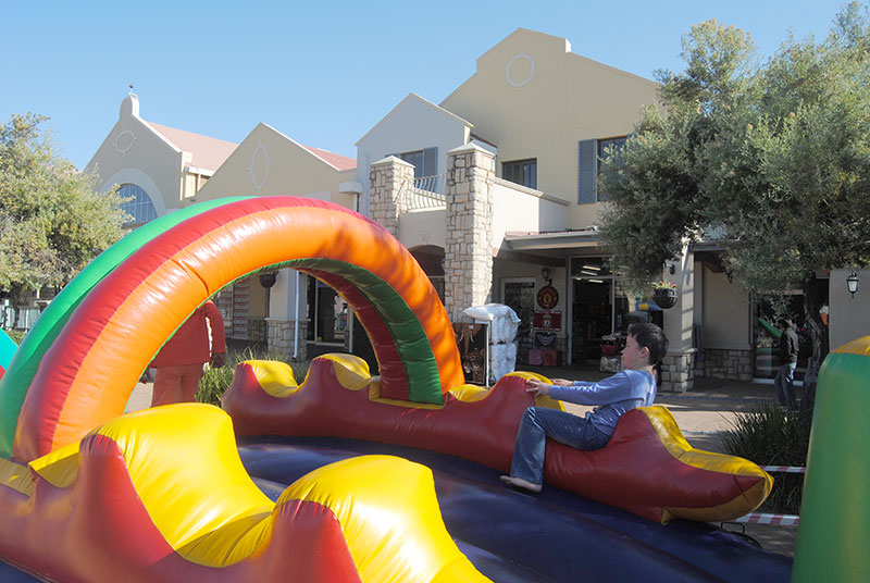 Colorful toddler jumping castle set up outside a venue