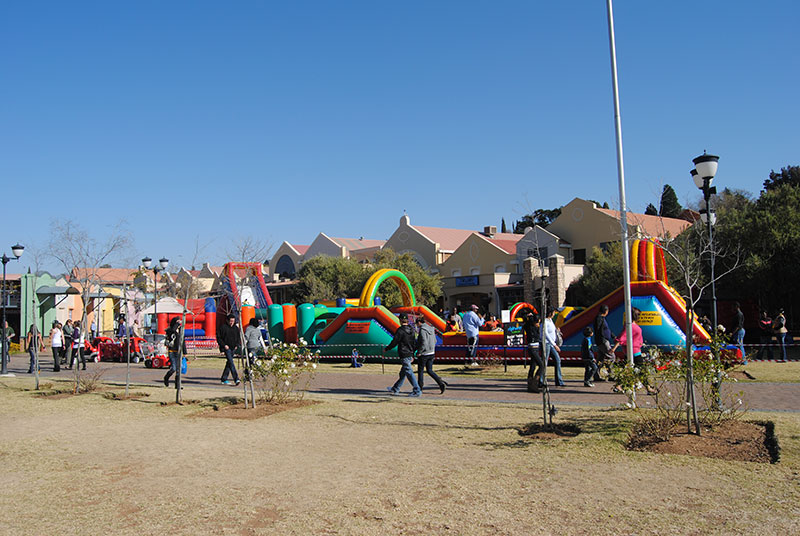 Outdoor view of multiple inflatable setups in a park
