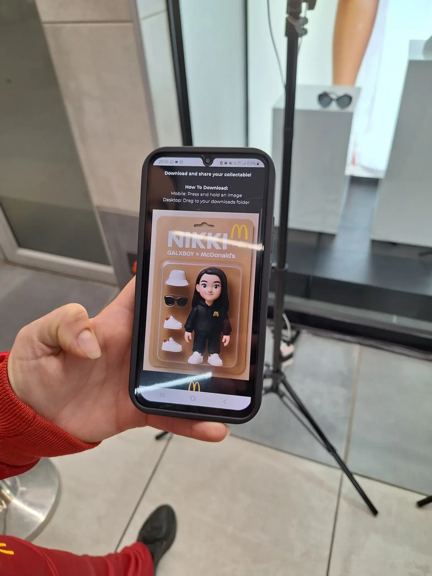 Smartphone showing Nikki McDonald's collectible