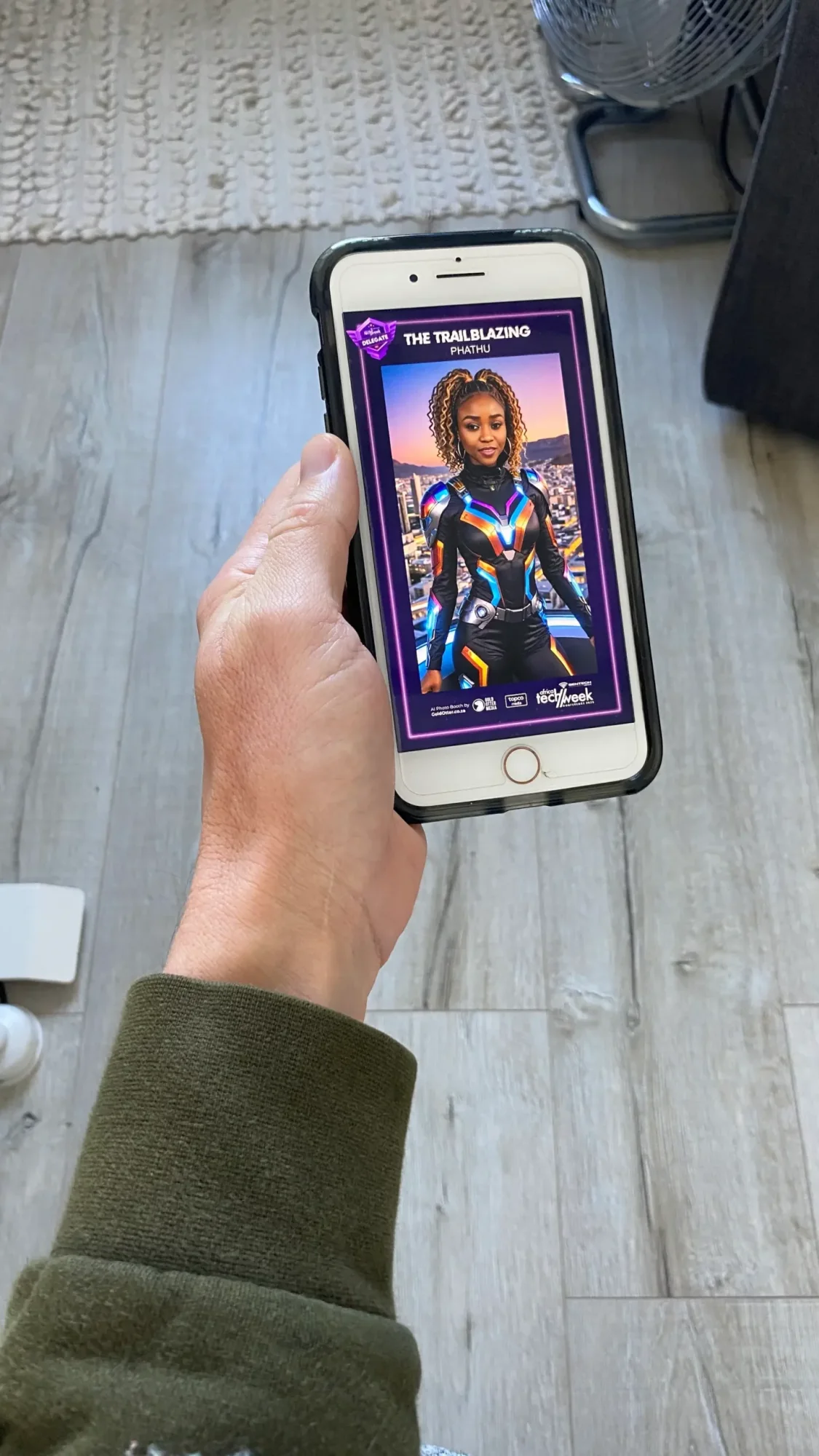 Person holding a smartphone with an AI-generated character displayed