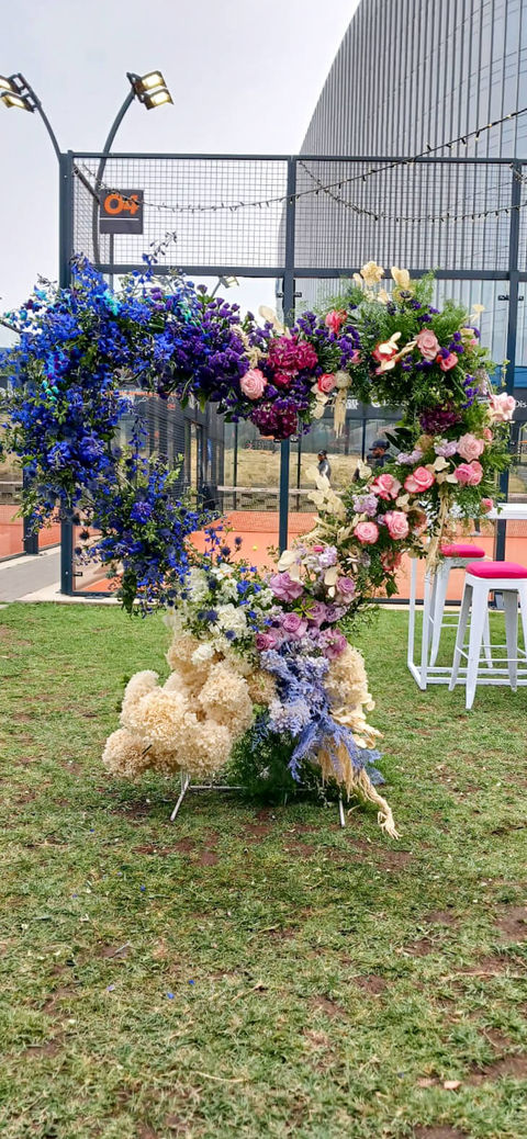 Floral arrangement in the shape of a number, featuring a variety of flowers.