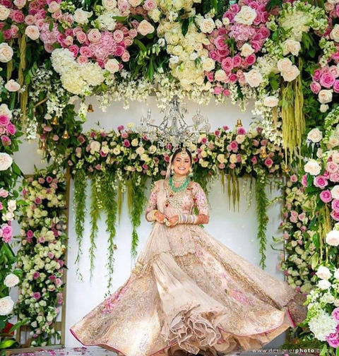 Floral wedding backdrop with roses and greenery
