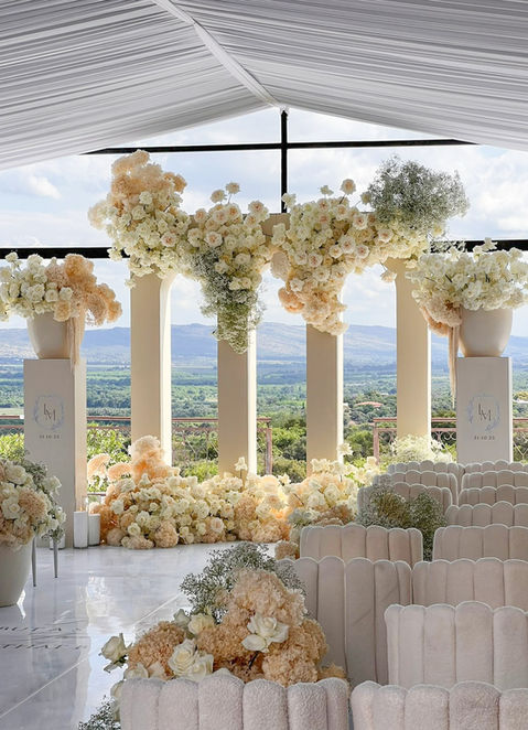 Floral installation with large arrangements and elegant columns