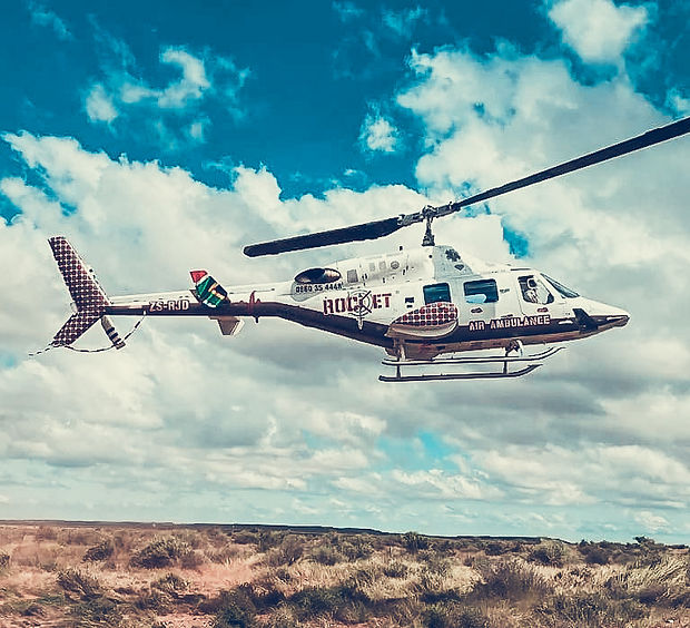 Helicopter marked as Air Ambulance in the sky