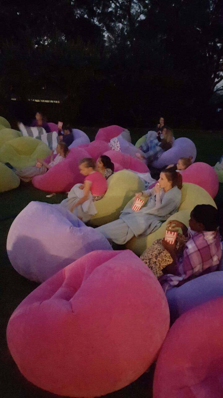 Colorful bean bags set up for guests at an outdoor event