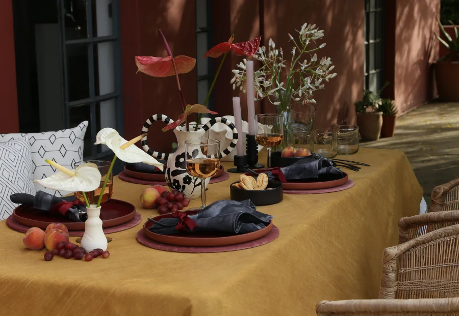 A styled table with floral arrangements and elegant tableware