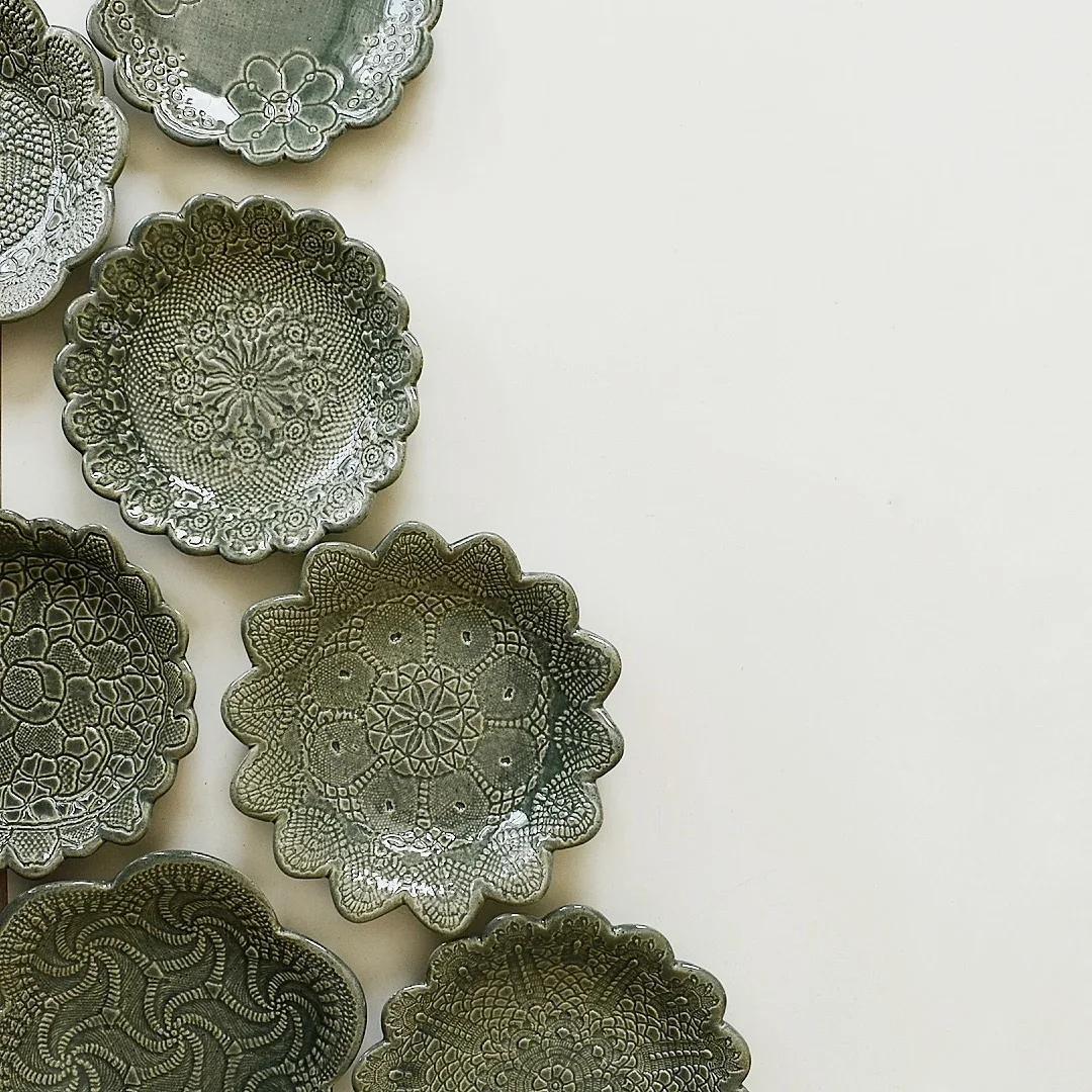Collection of handcrafted ceramic plates with intricate designs