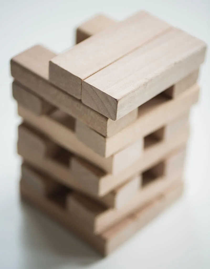 Stacked wooden blocks for a team building activity