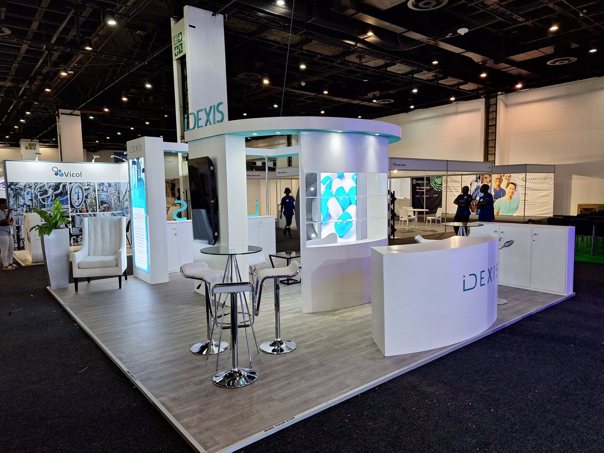 A custom-designed exhibition stand with a sleek layout and branding.