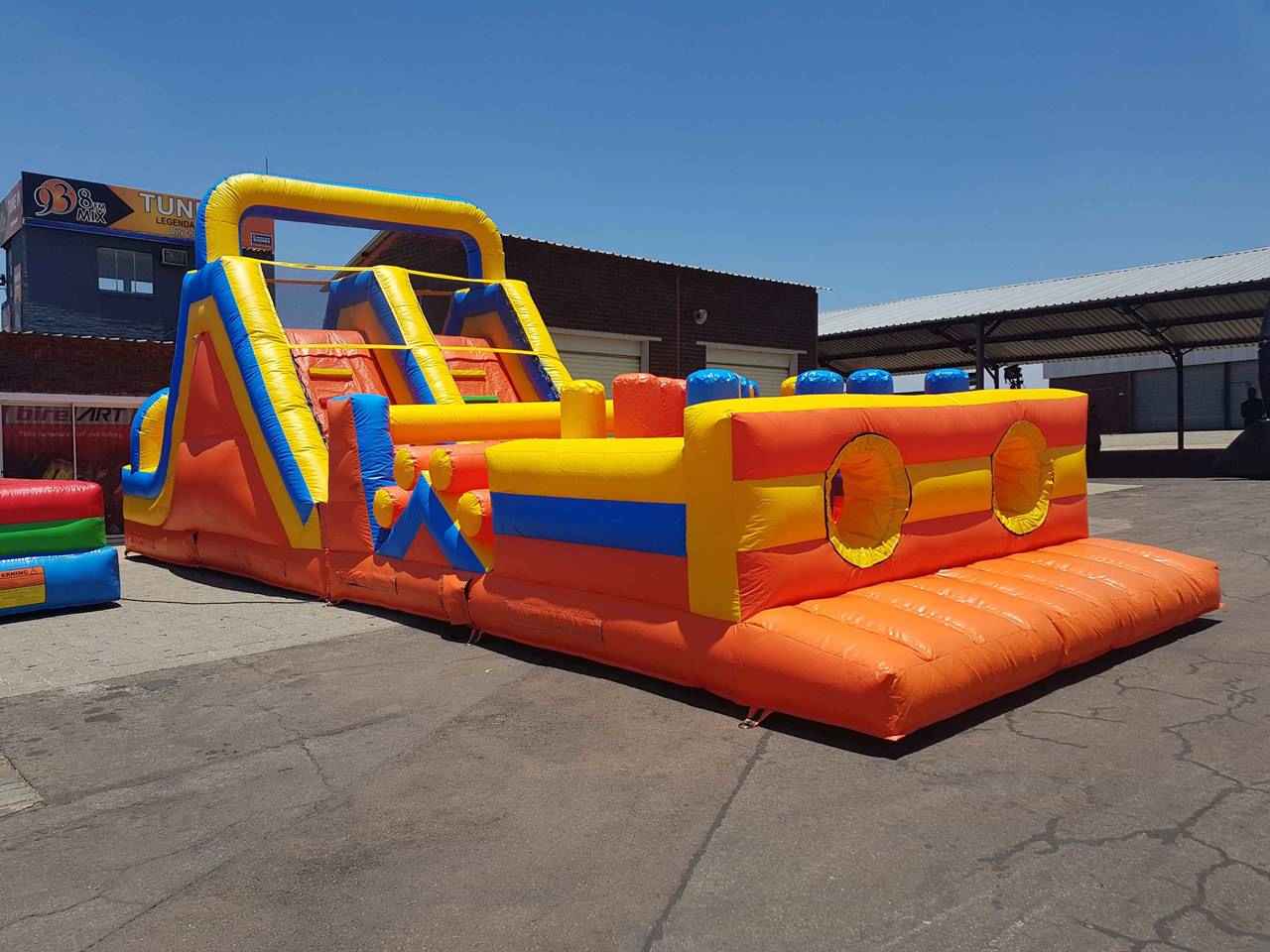 Brightly colored inflatable obstacle course in an outdoor setting