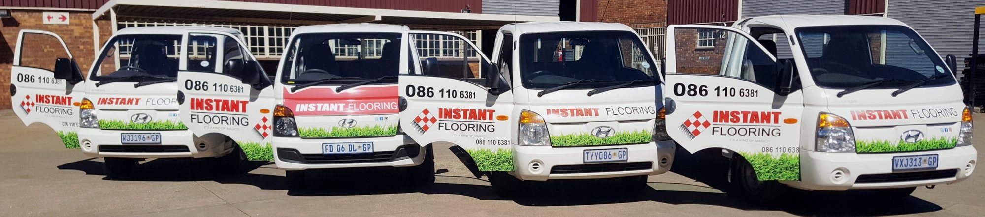 Four branded delivery vehicles for Instant Flooring