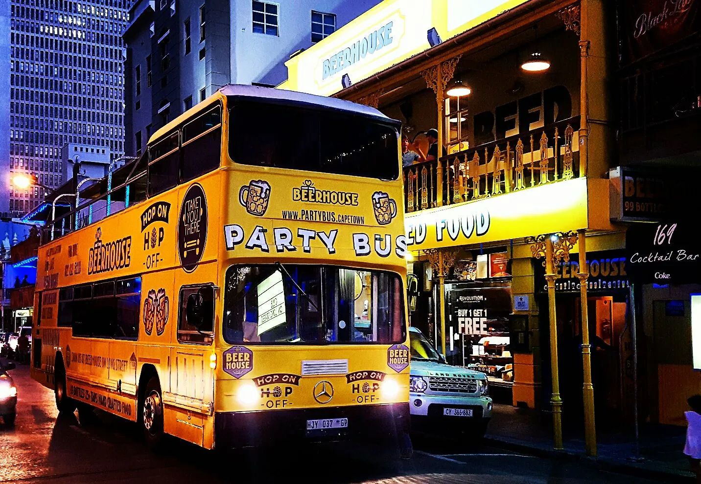 Yellow party bus parked outside Beerhouse in Johannesburg