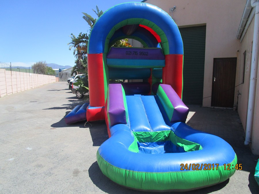 Colorful inflatable water slide setup in an event space