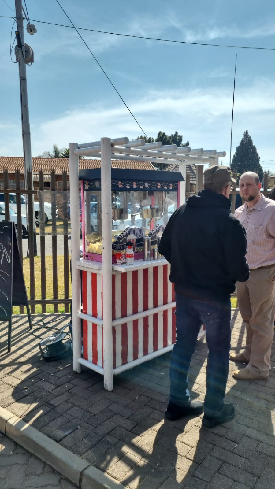 A colorful snack cart with a variety of treats