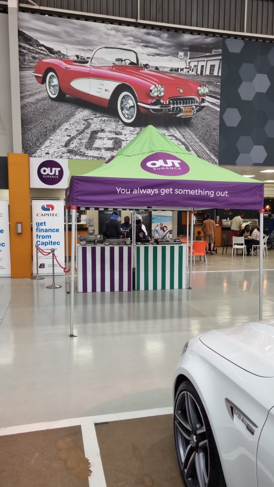 Promotional event booth with colorful canopy and branding