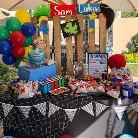 Colorful themed birthday party setup with treats and decorations