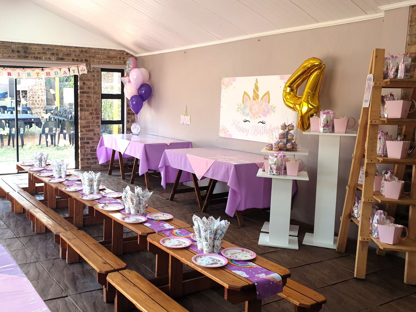 Decorated birthday party setup with tables and decorations