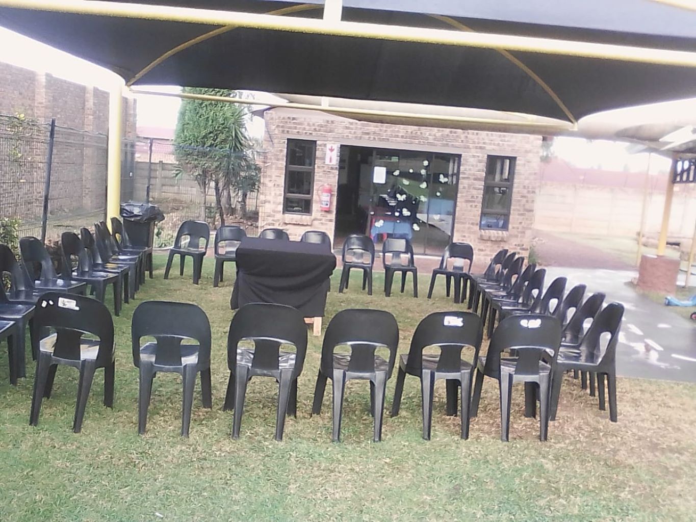 Chairs arranged in a circle in an outdoor space