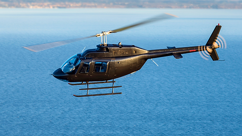 Helicopter flying over water