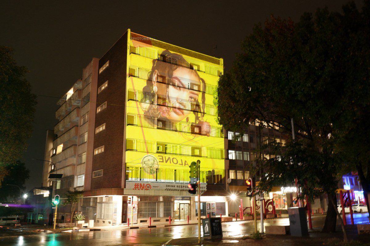 Building projection featuring a large graphic on a city building