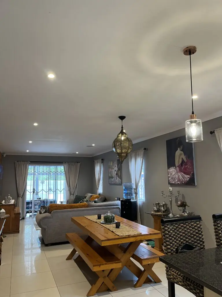 Interior view with decorative lighting and furniture in a living space.