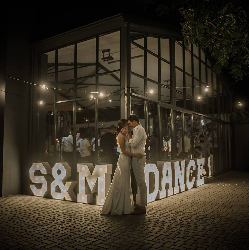 Illuminated marquee letters at a wedding reception