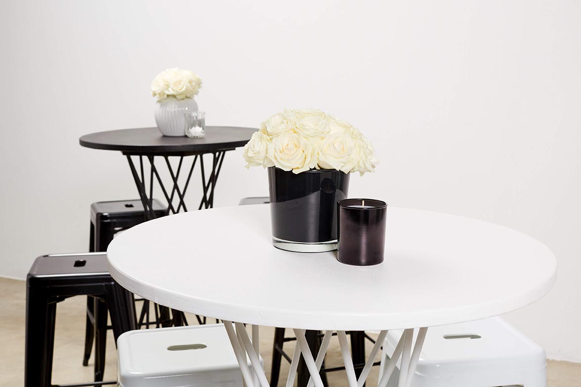 Chic table setup with flowers and candles for events.