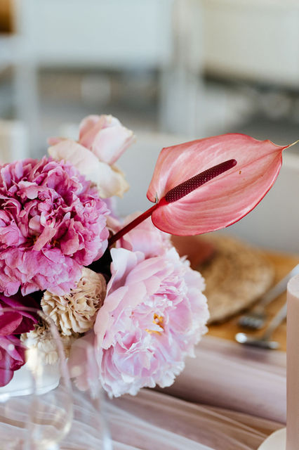 Floral arrangement with pink peonies and anthurium