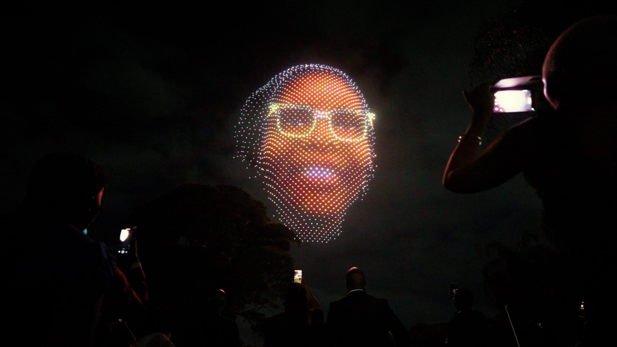 Drone light show featuring a custom visual display in the night sky