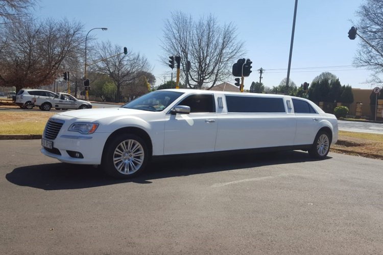 White Chrysler 300 C Limousine parked on the street