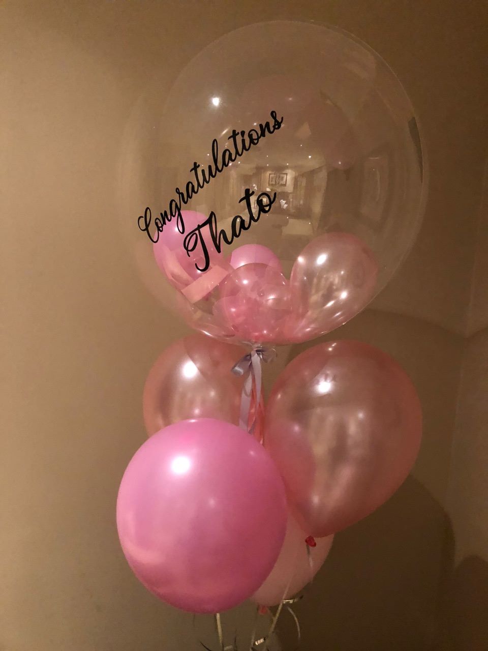 Personalised balloon bouquet with pink balloons and congratulatory message