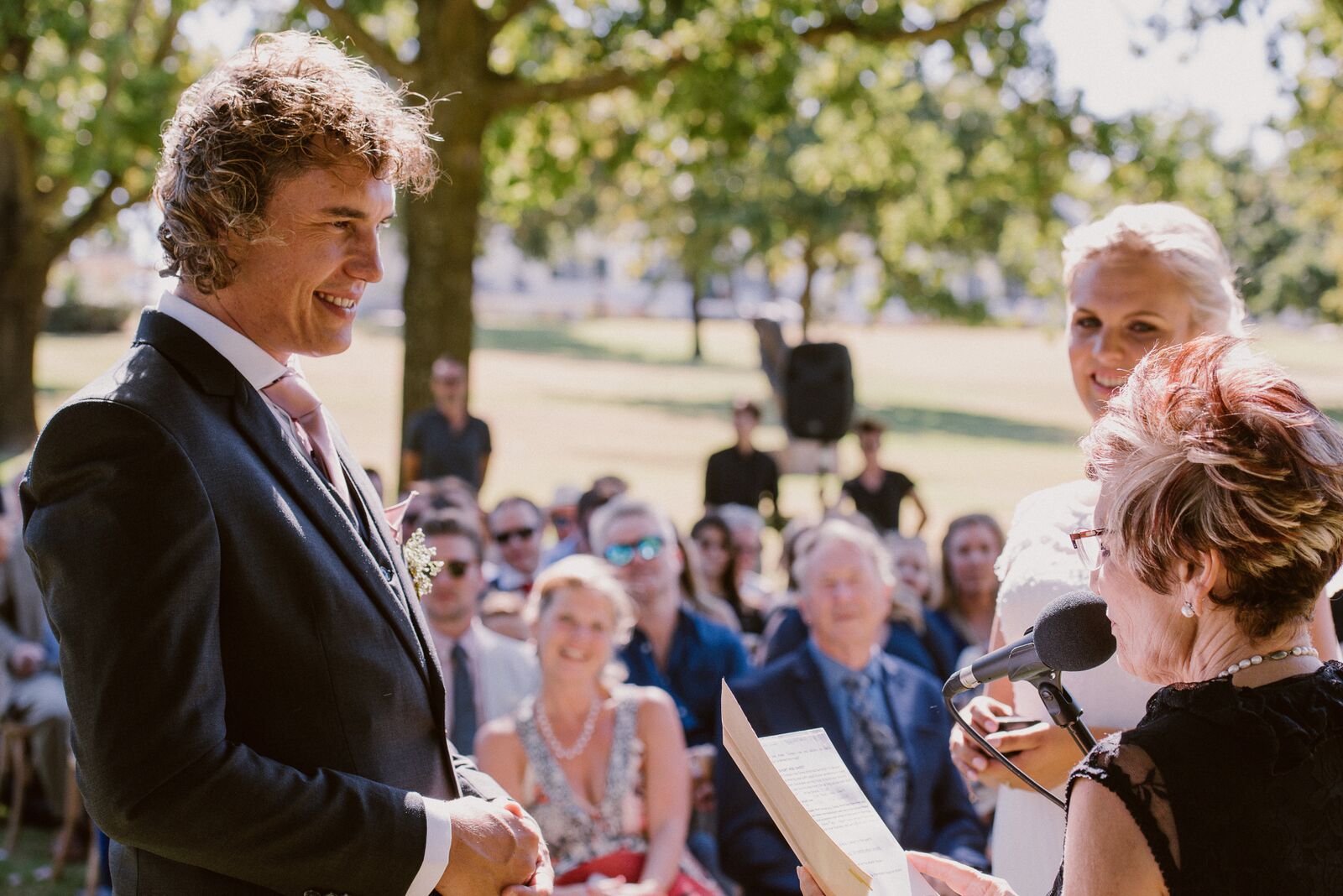 Couple exchanging vows during an outdoor wedding ceremony