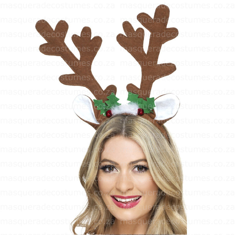 Woman in reindeer antler headband with holly