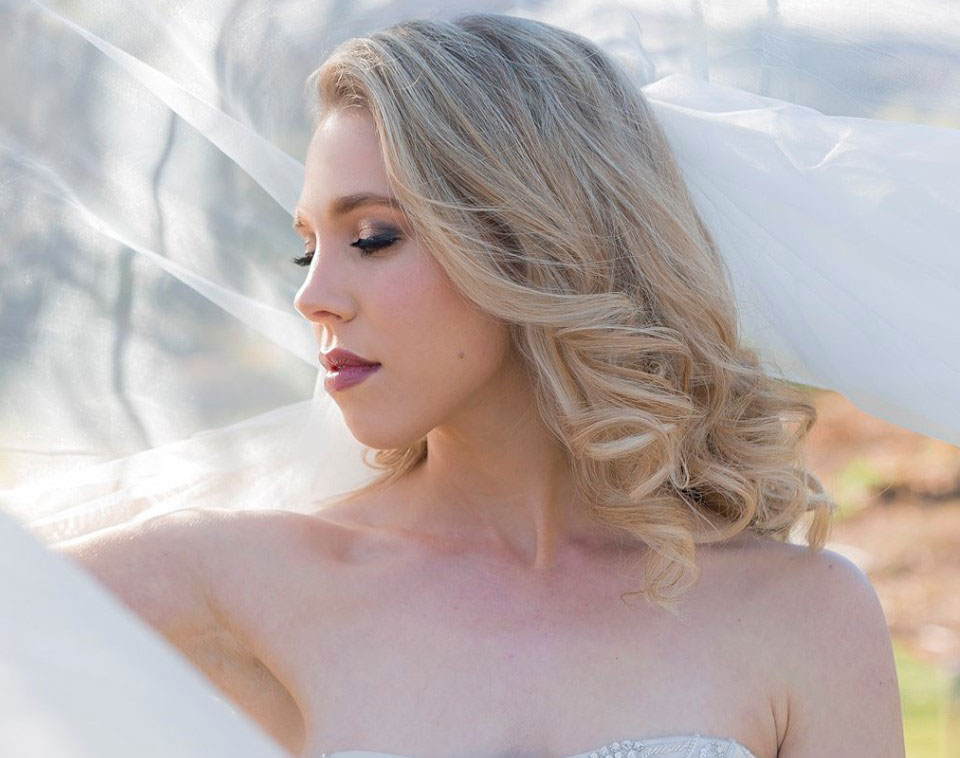 Profile of a bride with natural makeup and flowing blonde hair