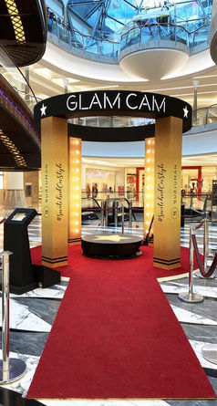 Glam Cam setup with a red carpet and lights