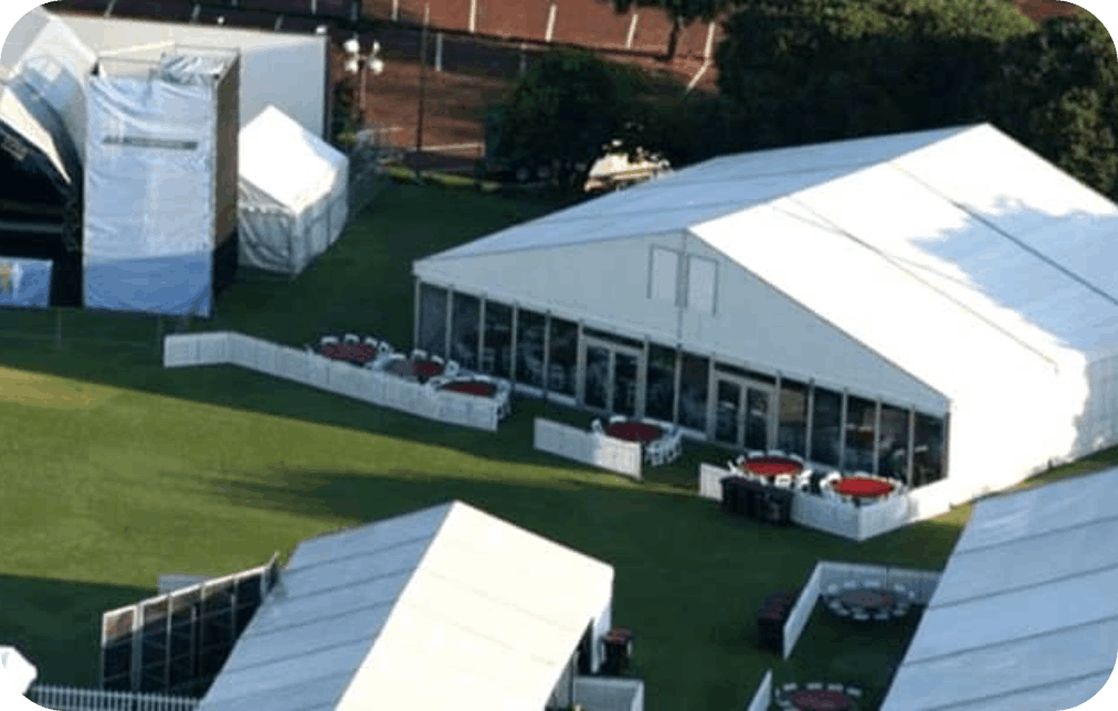 Aerial view of a large marquee setup with seating and tables