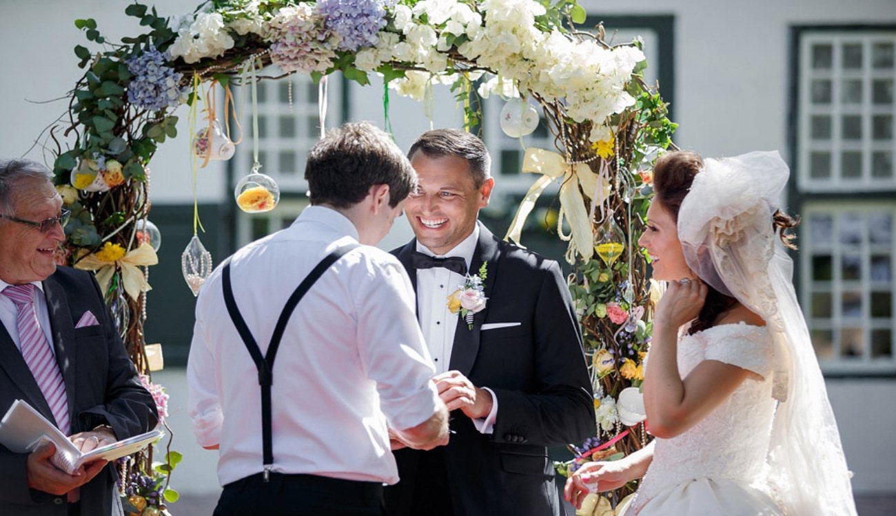 Wedding ceremony arch decorated with flowers