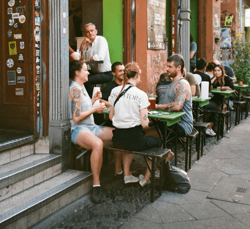 Group of friends enjoying drinks at a cafe setting