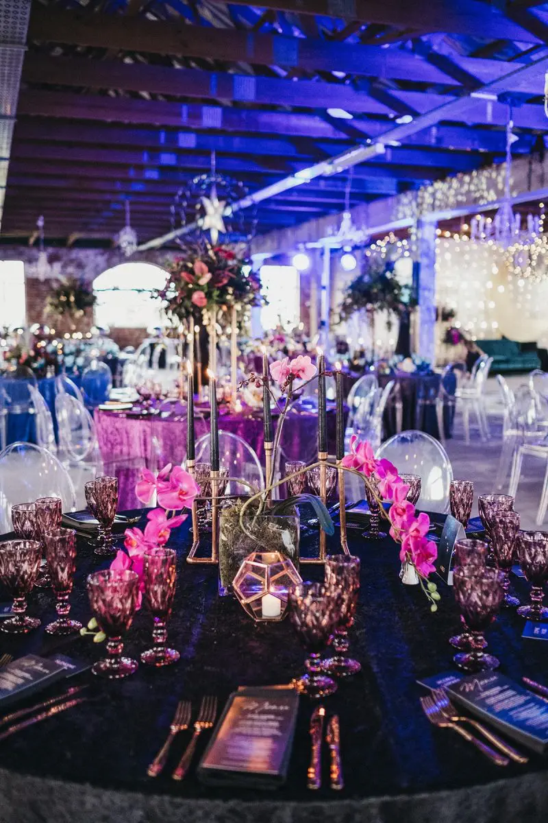 Sophisticated table setting with floral accents and elegant glassware.