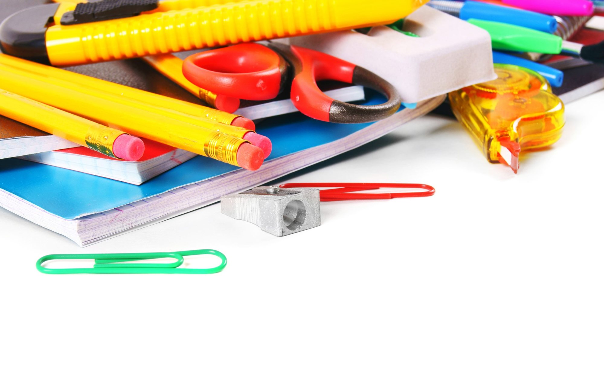 Various office supplies including pens, scissors, and notebooks.