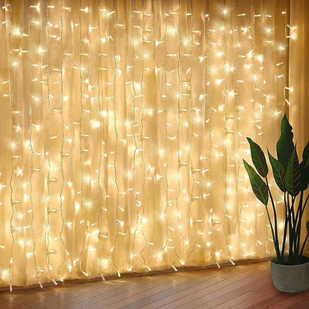 A curtain of warm white fairy lights hanging against a soft backdrop