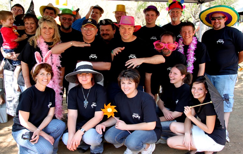A diverse group of people enjoying a team building activity outdoors